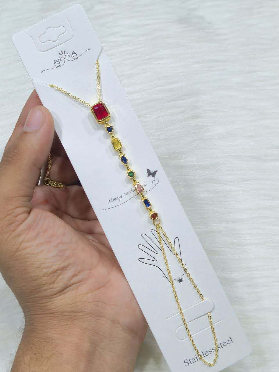Multi-stone birthstone or chakra bracelet featuring colored gemstones set in stainless steel.